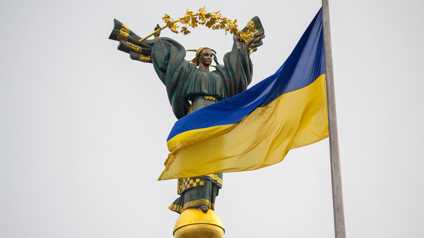 Independence monument and ukrainian flag in Kyiv, Ukraine