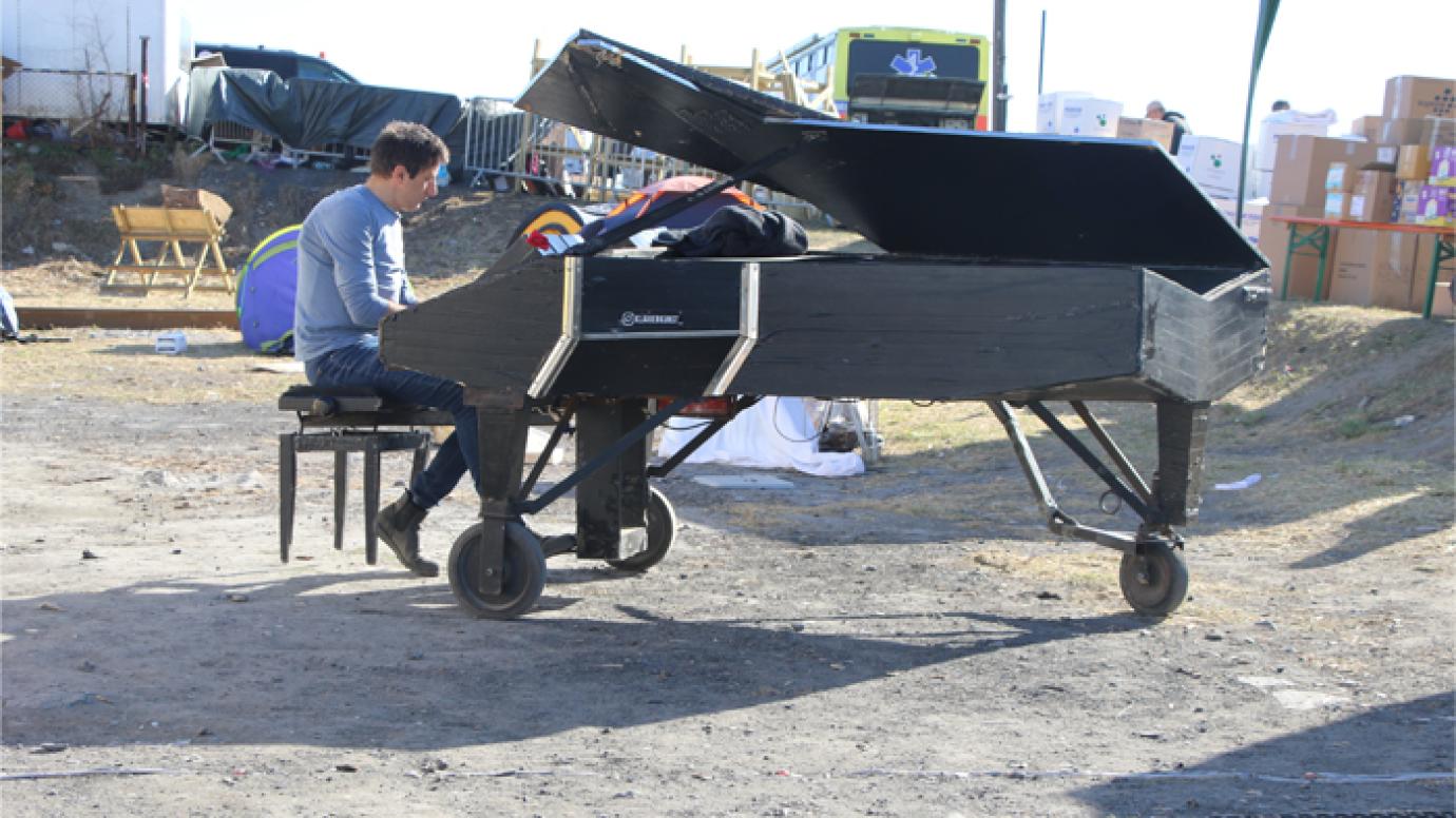 pianist playing in a reconstruction site